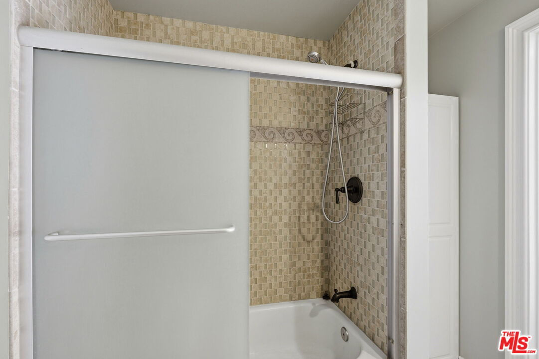18342 Blackhawk Street Porter Ranch, CA 91326 - Photo 40 of 56 a bathroom with a bathtub