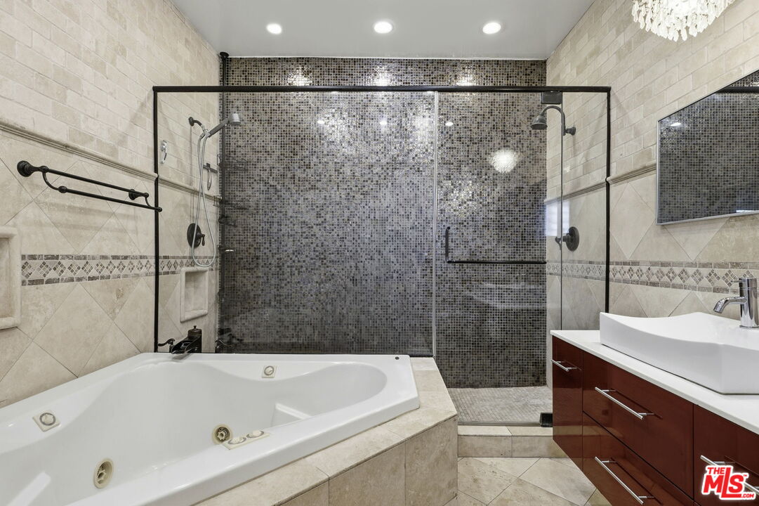 18342 Blackhawk Street Porter Ranch, CA 91326 - Photo 44 of 56 a bathroom with a bathtub and a sink