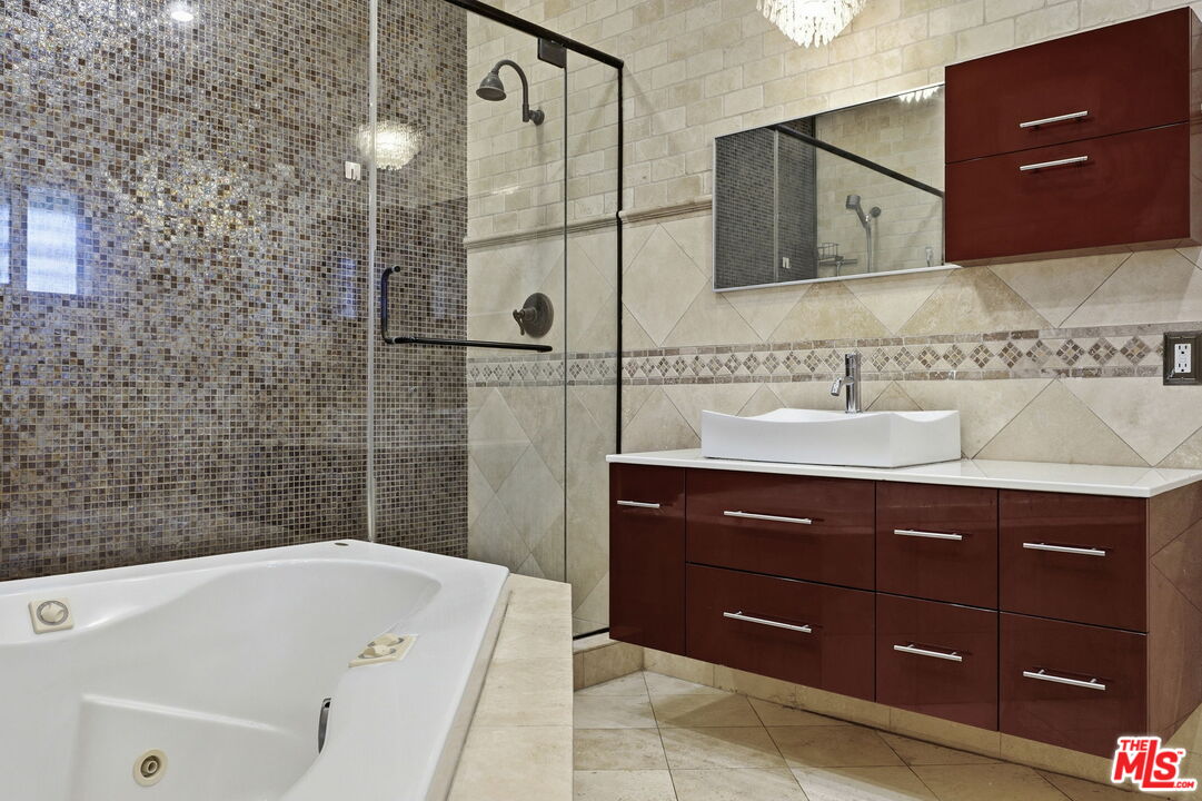 18342 Blackhawk Street Porter Ranch, CA 91326 - Photo 45 of 56 a bathroom with a sink and a bathtub