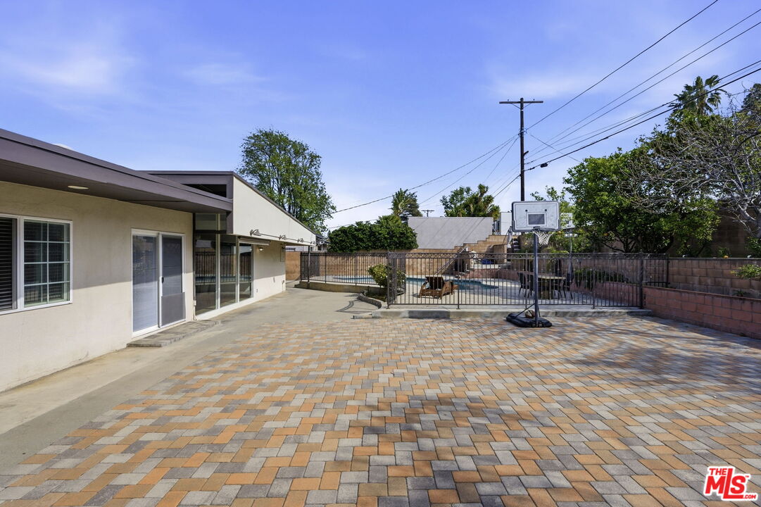 18342 Blackhawk Street Porter Ranch, CA 91326 - Photo 48 of 56 a view of a backyard with sitting area