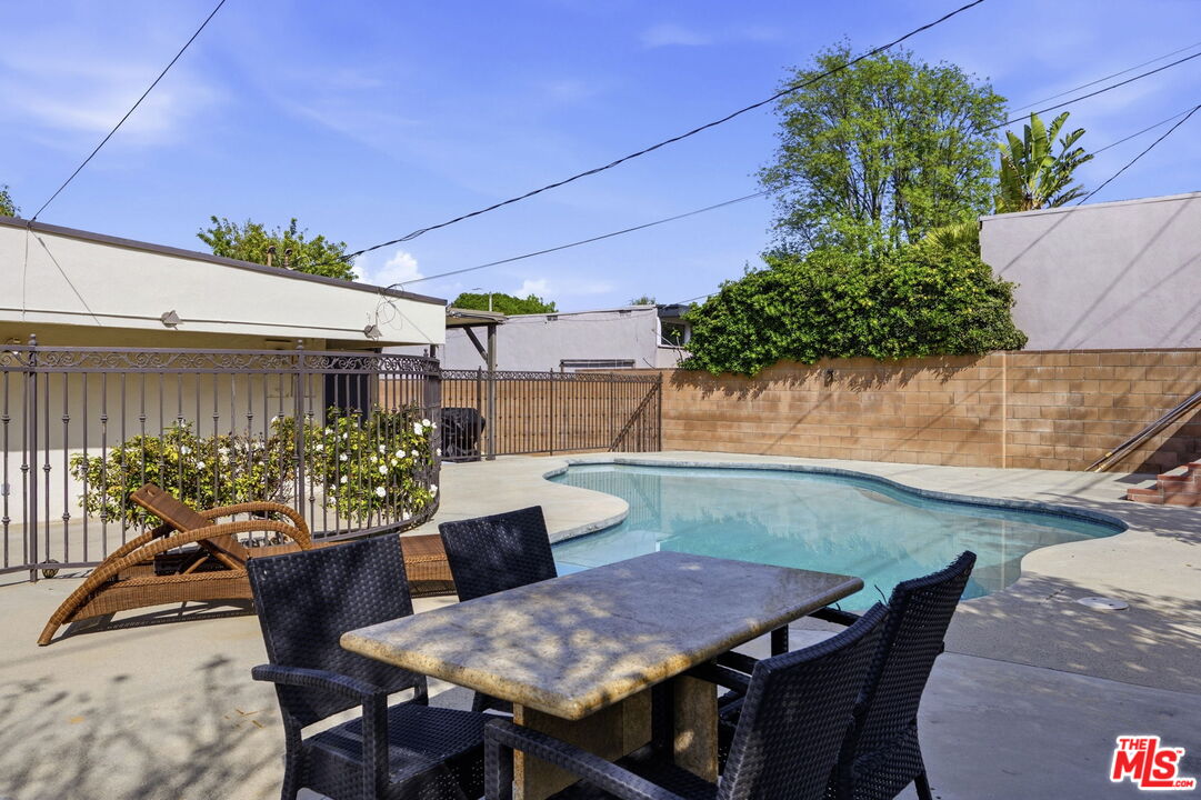 18342 Blackhawk Street Porter Ranch, CA 91326 - Photo 53 of 56 a view of a dining tables and chairs in a patio