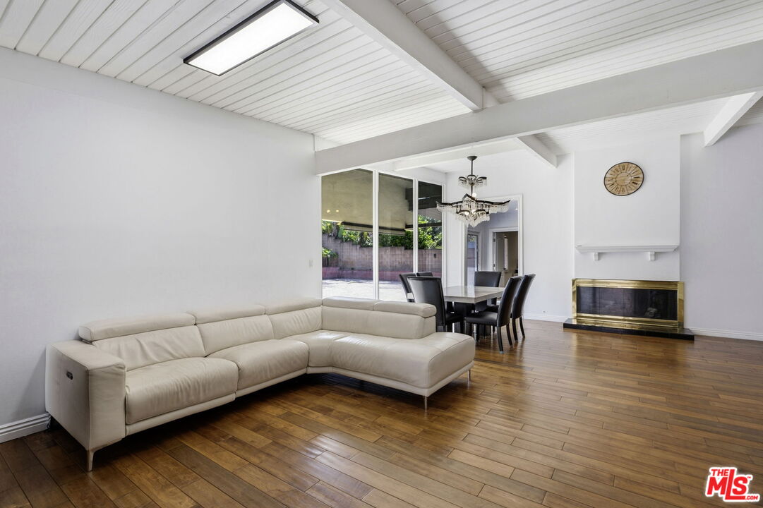 18342 Blackhawk Street Porter Ranch, CA 91326 - Photo 8 of 56 a living room with furniture and a large window