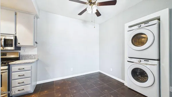 a view of kitchen sink and a stove top oven