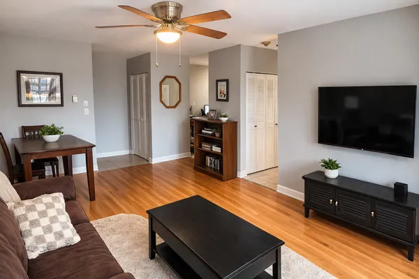 a living room with furniture and a flat screen tv