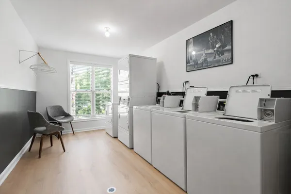 a work room with furniture and a window