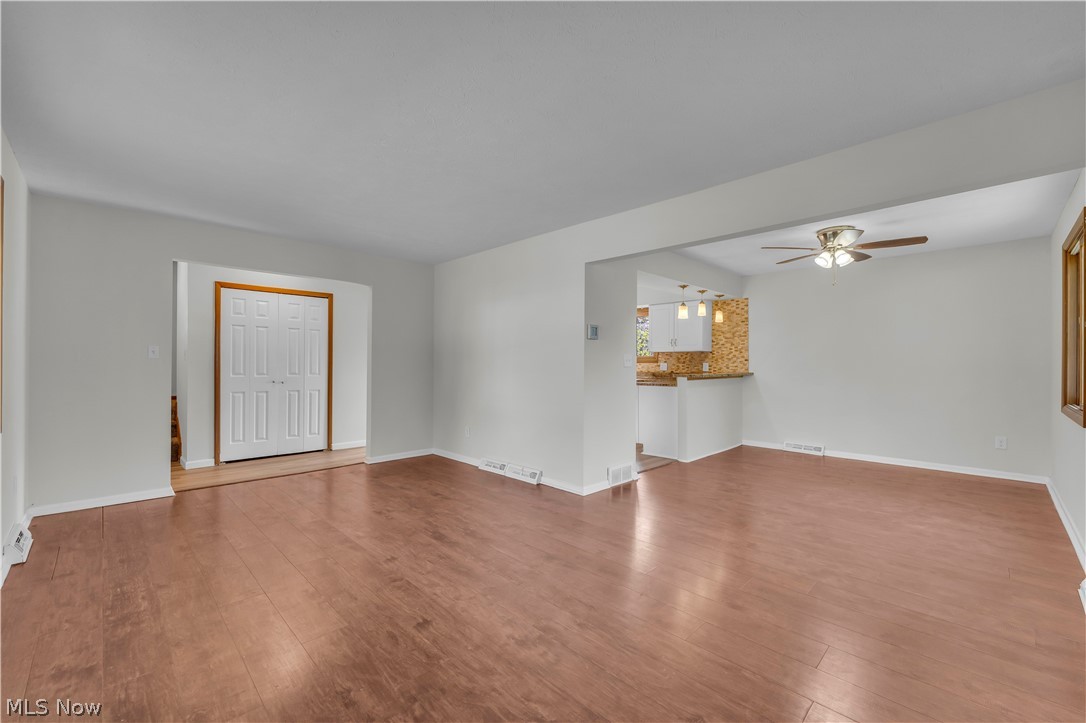 2540 Charney Road University Heights, OH 44118 - Photo 22 of 44 Spacious main living area featuring wood-finish flooring and light gray walls