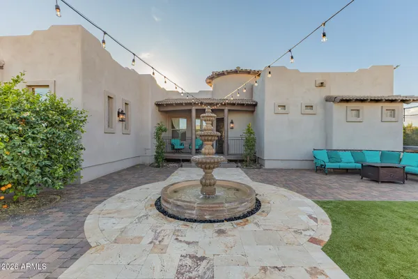 an empty room with a mirror and door