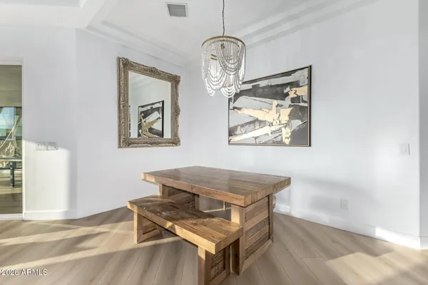 a kitchen with granite countertop a refrigerator and a sink
