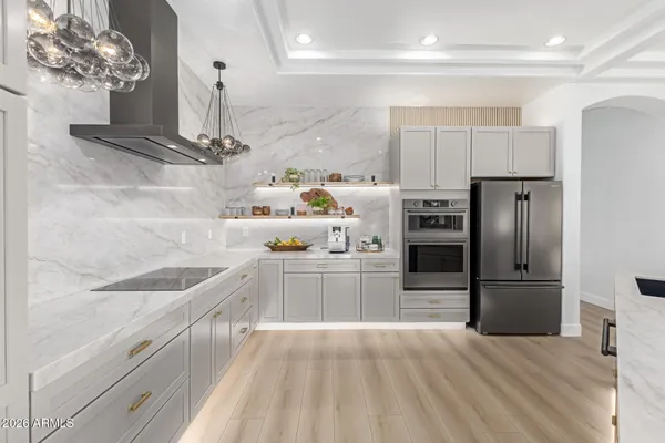 a view of a kitchen with dining table and chairs