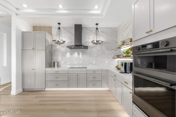 a kitchen with cabinets and window