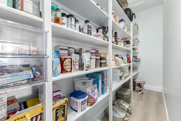a bathroom with a sink a mirror and shower