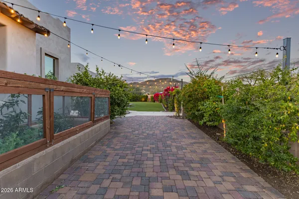 a view of a fountain in front of a house