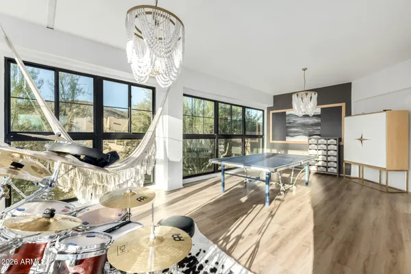 a utility room with wooden floor washer and dryer
