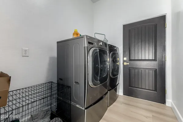 a utility room with dryer and washer
