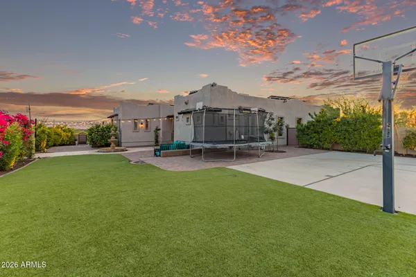 a view of a patio with a yard