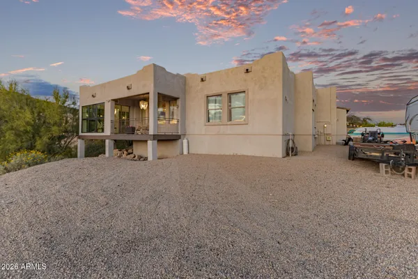 a view of a balcony with furniture