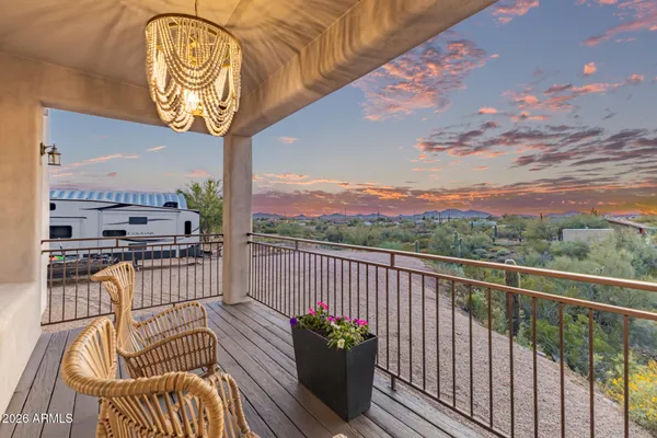 a view of a balcony with furniture
