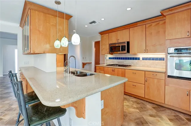 a view of a room with wooden floor and a window
