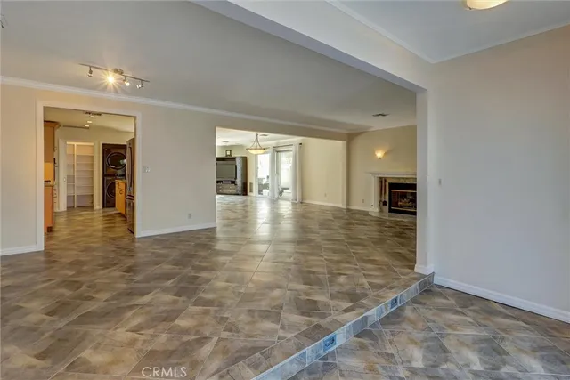 a kitchen with stainless steel appliances granite countertop a sink counter space and a window