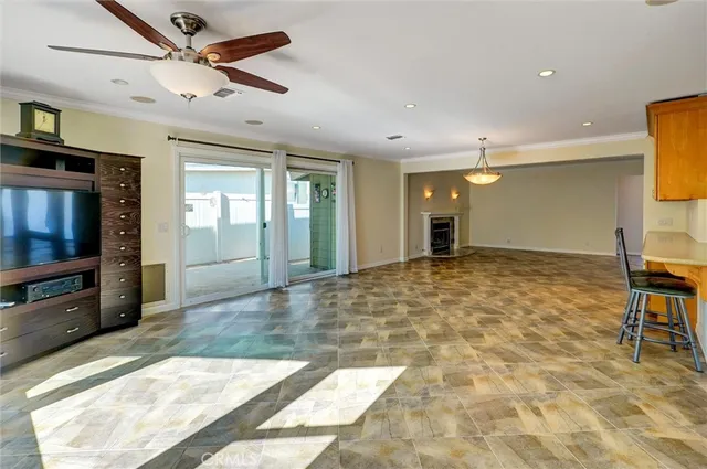 a large kitchen with stainless steel appliances granite countertop a sink and cabinets