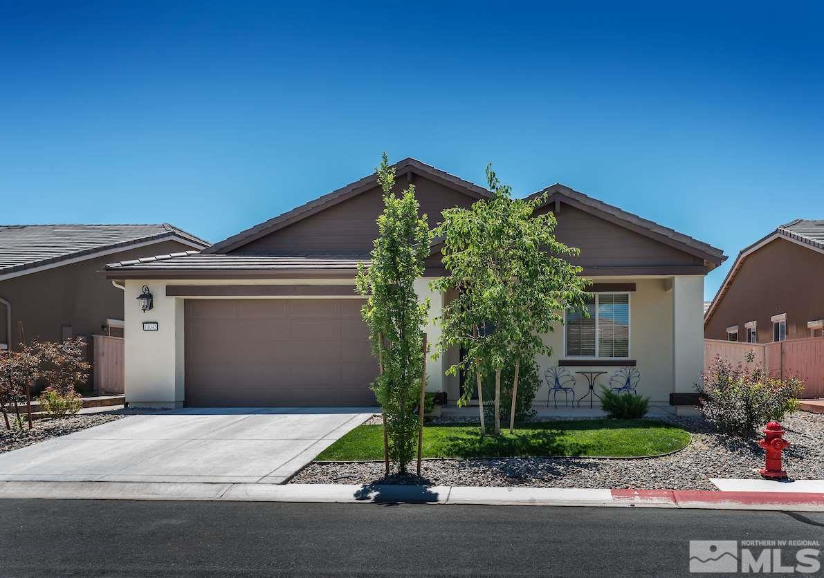 10045 Ignacio Circle Reno, NV 89521 - Photo 1 of 12 a front view of a house with garden