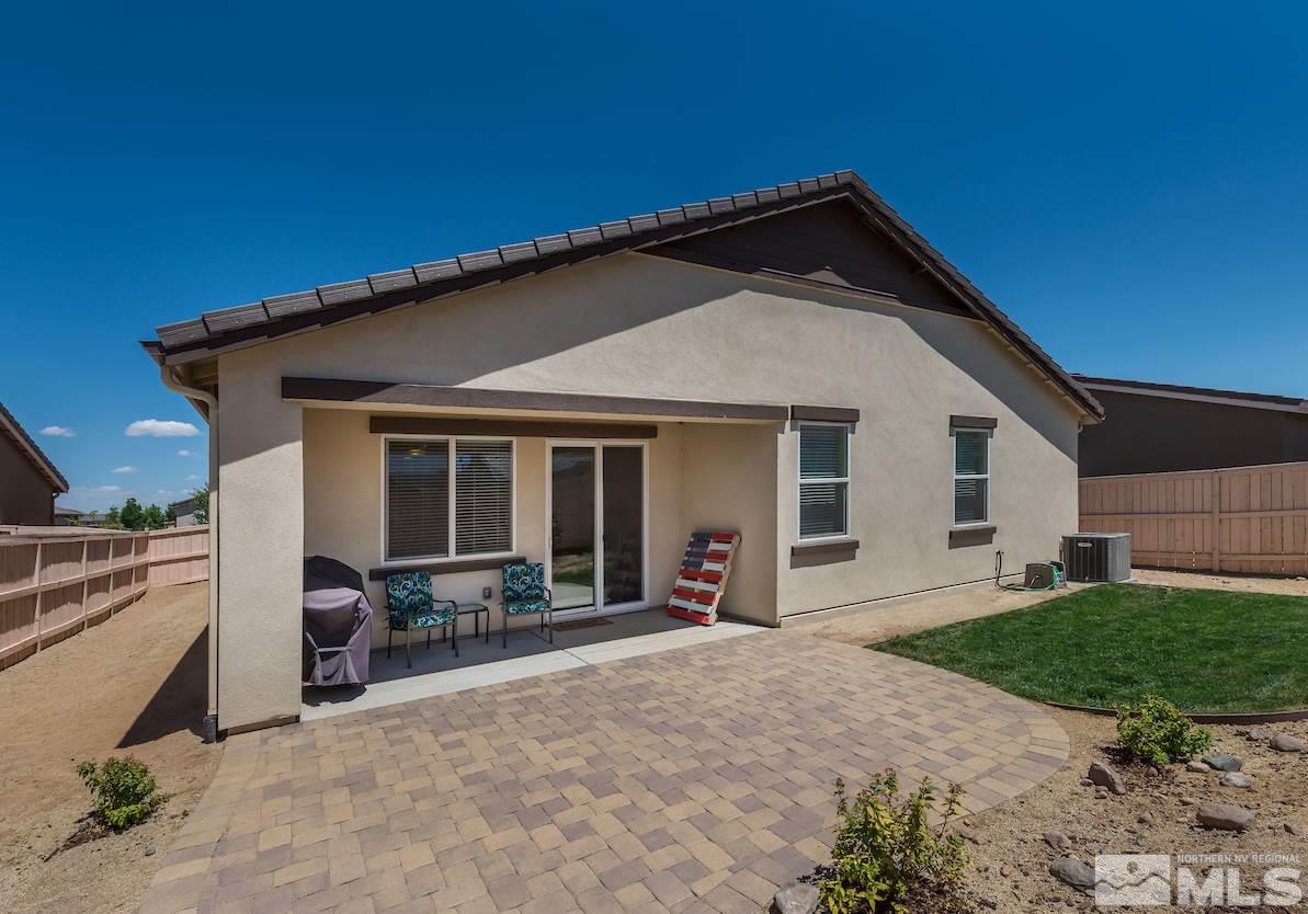 10045 Ignacio Circle Reno, NV 89521 - Photo 12 of 12 a view of a house with a yard and seating space