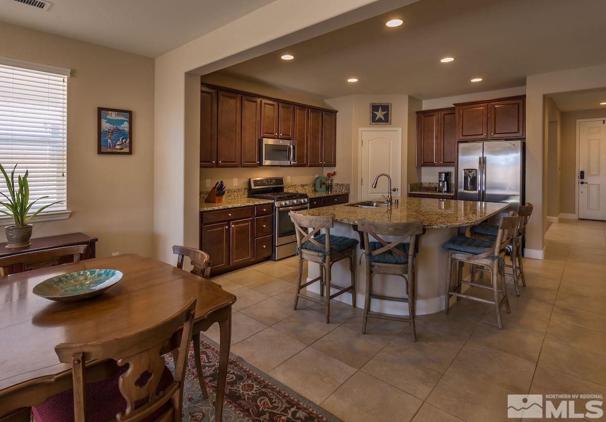 10045 Ignacio Circle Reno, NV 89521 - Photo 3 of 12 a view of a dining room with furniture