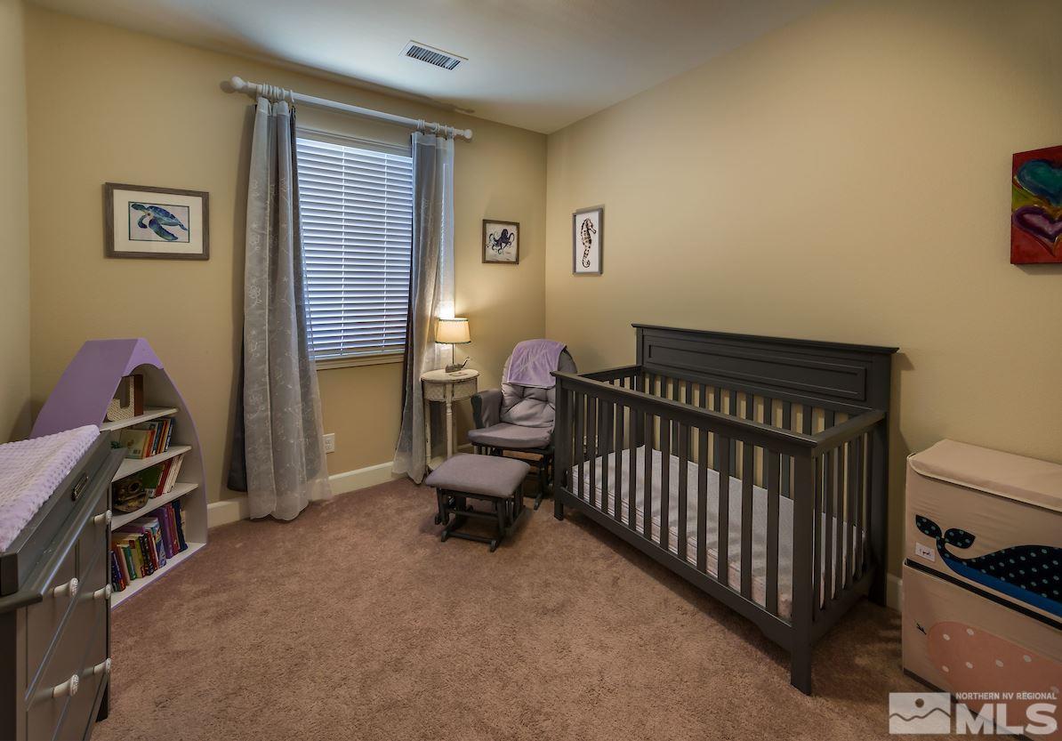 10045 Ignacio Circle Reno, NV 89521 - Photo 9 of 12 a bedroom with a bed and a window