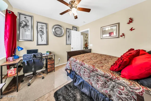 a bedroom with a bed and cabinets