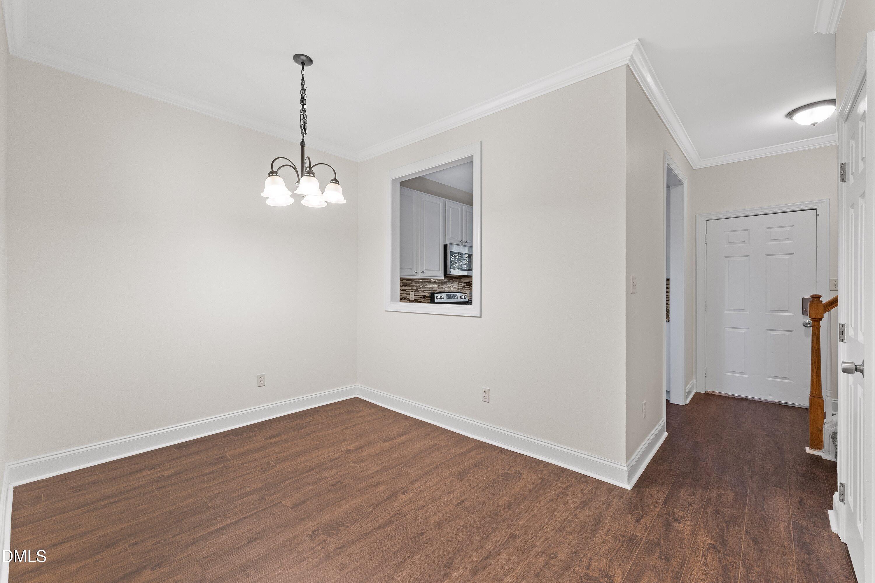4120 Standing Rock Way Raleigh, NC 27604 - Photo 10 of 37 a view of a room with wooden floor and window