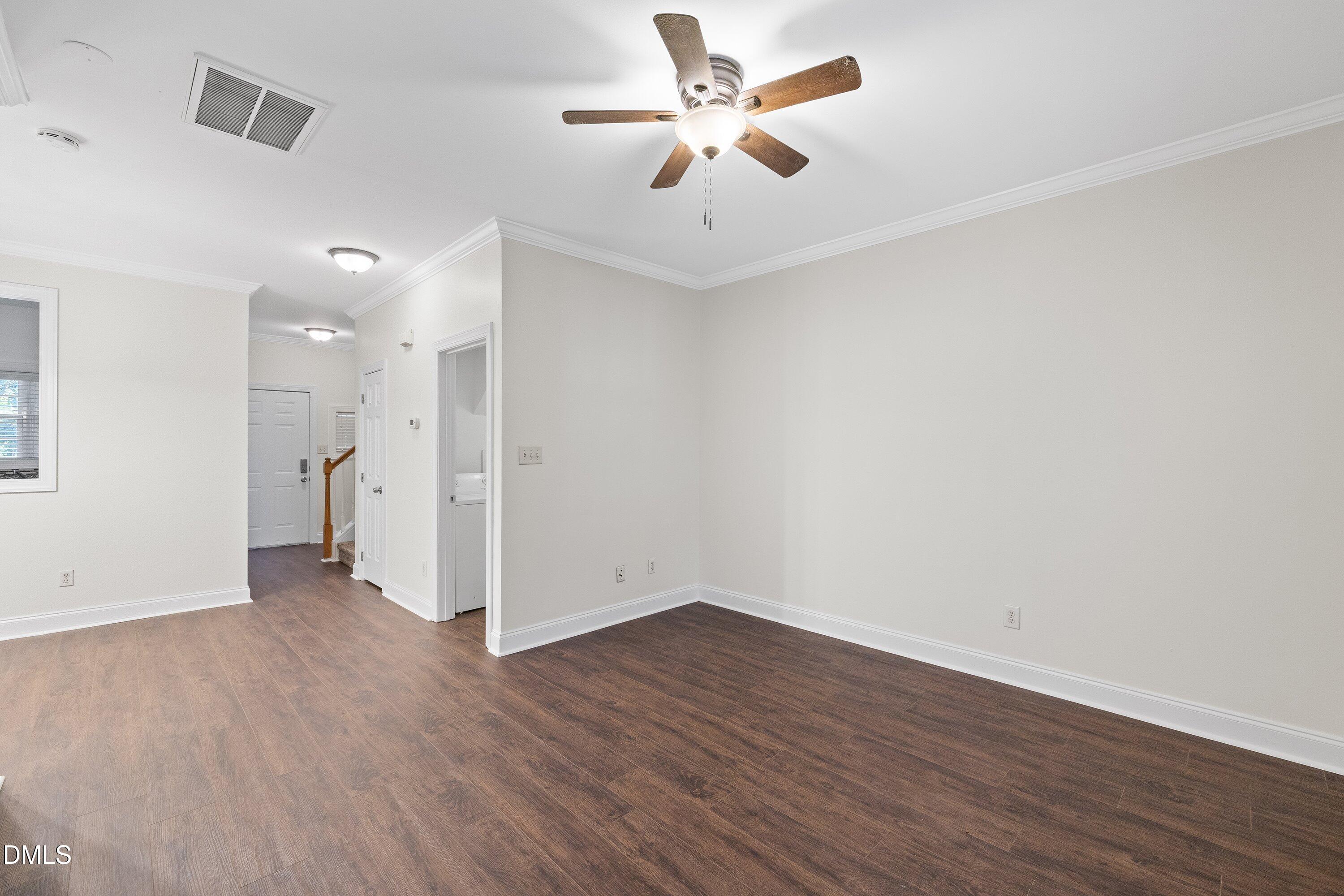 4120 Standing Rock Way Raleigh, NC 27604 - Photo 15 of 37 a view of a big room with wooden floor and a ceiling fan