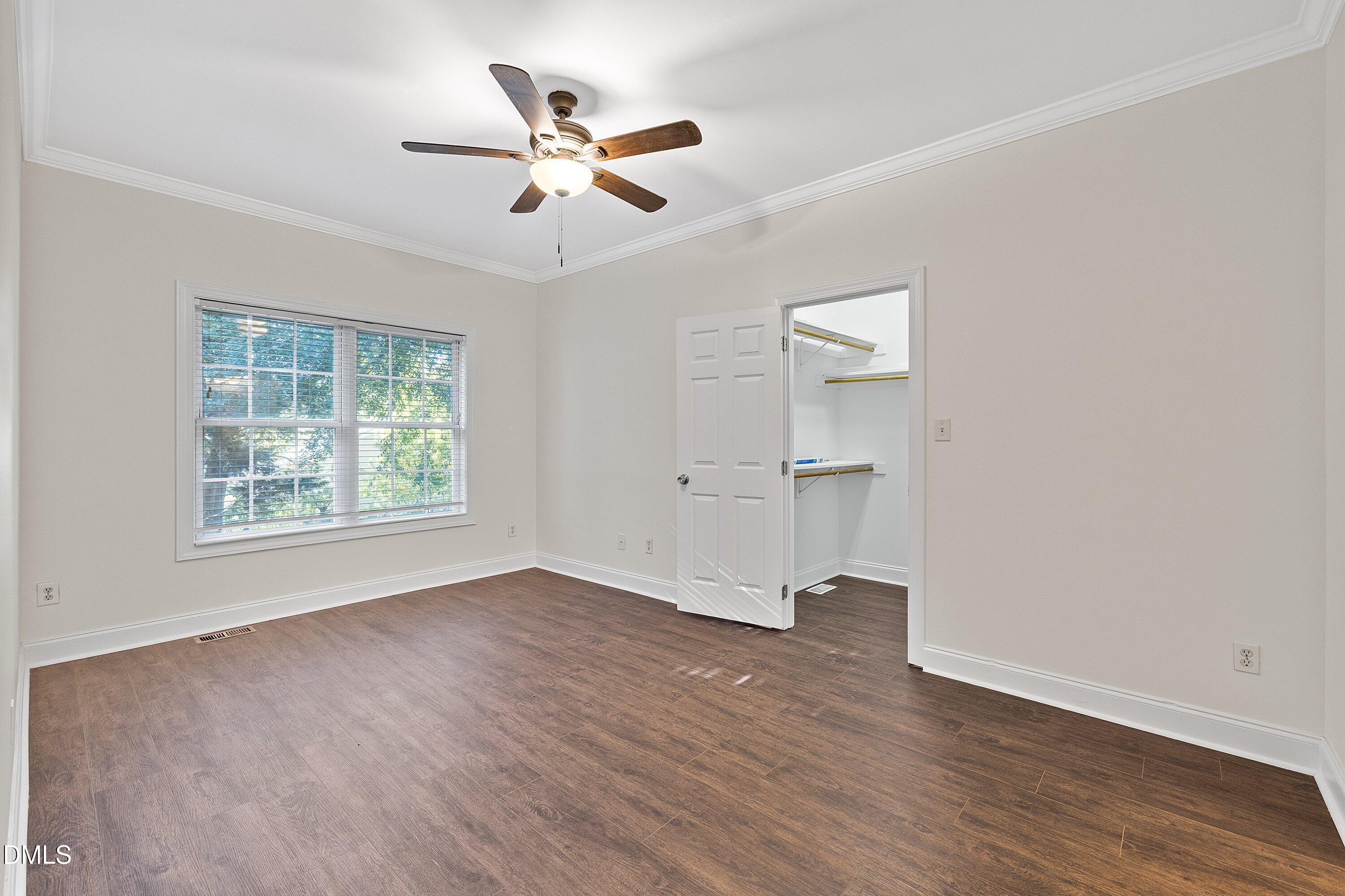 4120 Standing Rock Way Raleigh, NC 27604 - Photo 17 of 37 a view of an empty room with a window and wooden floor