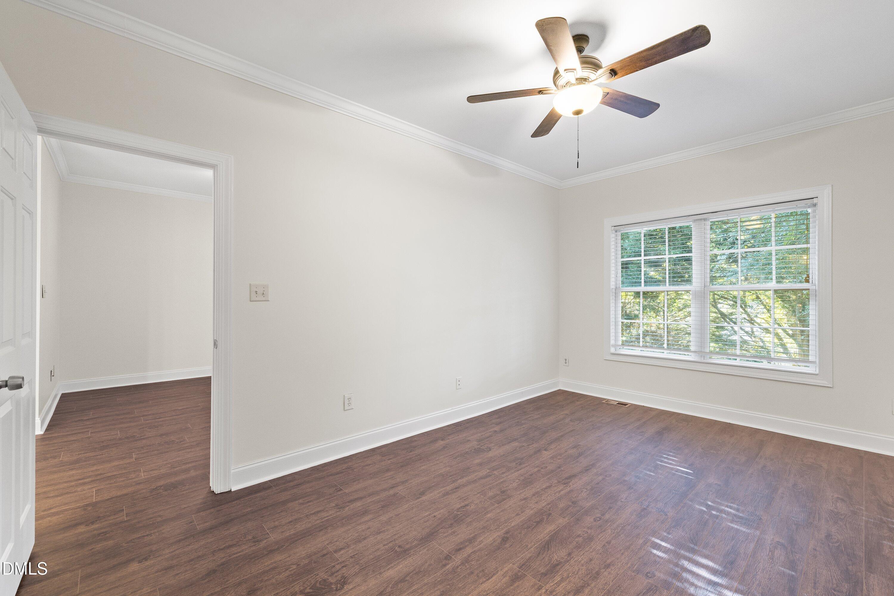 4120 Standing Rock Way Raleigh, NC 27604 - Photo 19 of 37 wooden floor in an empty room with a window