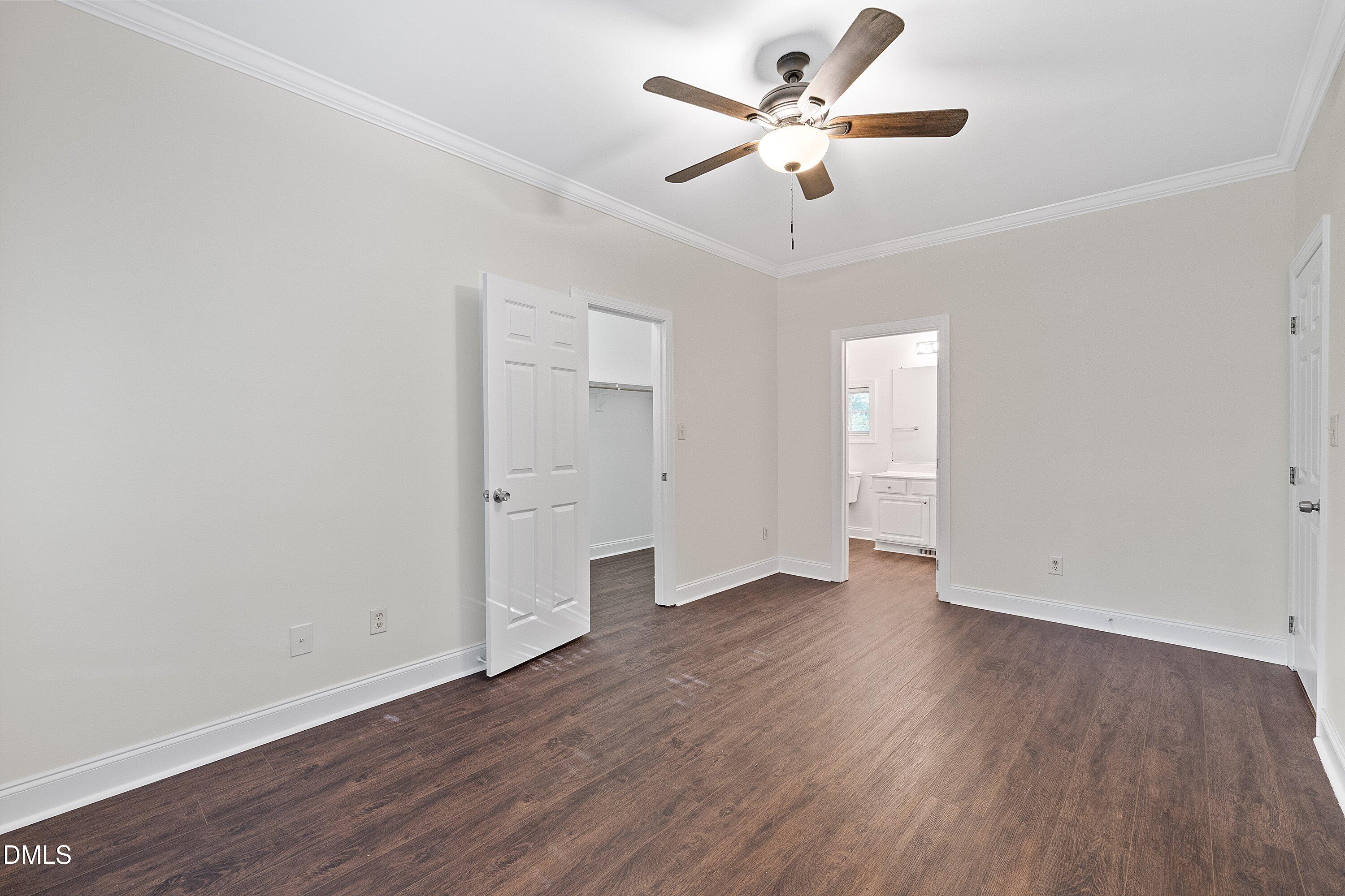 4120 Standing Rock Way Raleigh, NC 27604 - Photo 21 of 37 an empty room with wooden floor ceiling fan and window