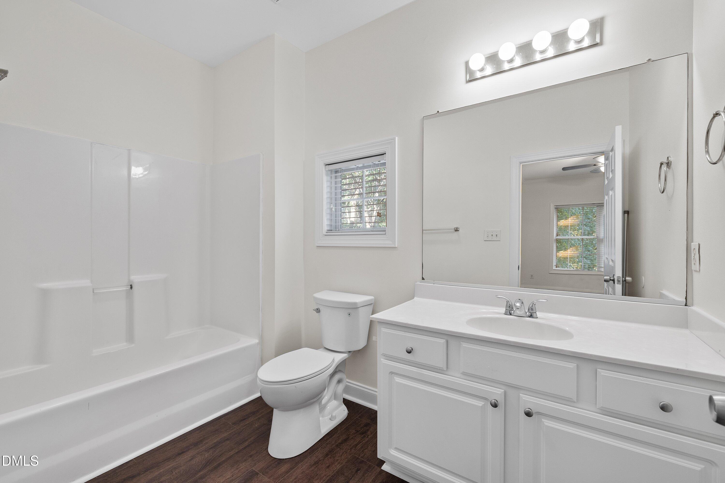 4120 Standing Rock Way Raleigh, NC 27604 - Photo 23 of 37 a bathroom with a sink a toilet and a bathtub