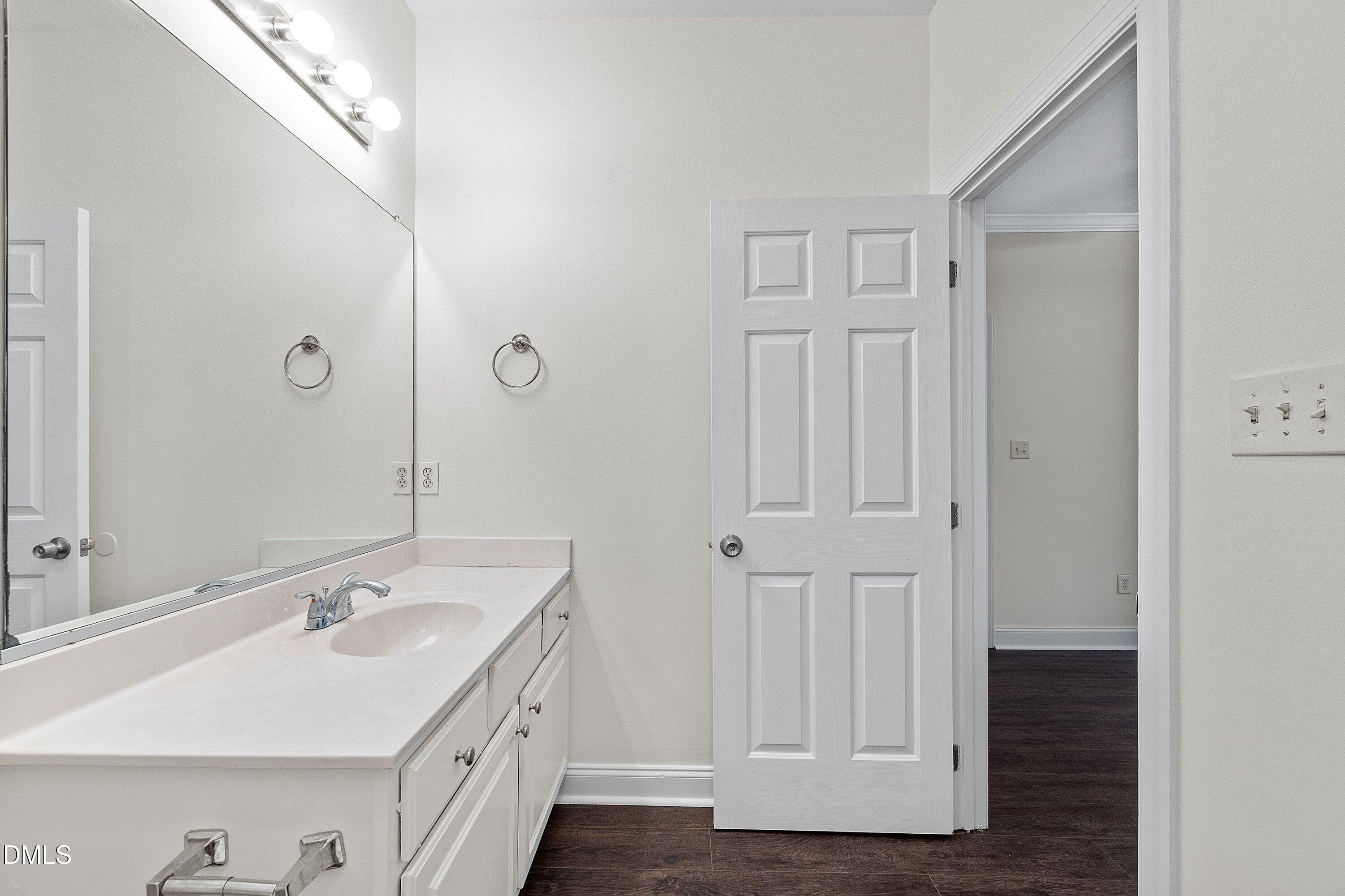 4120 Standing Rock Way Raleigh, NC 27604 - Photo 24 of 37 a bathroom with a sink and a mirror