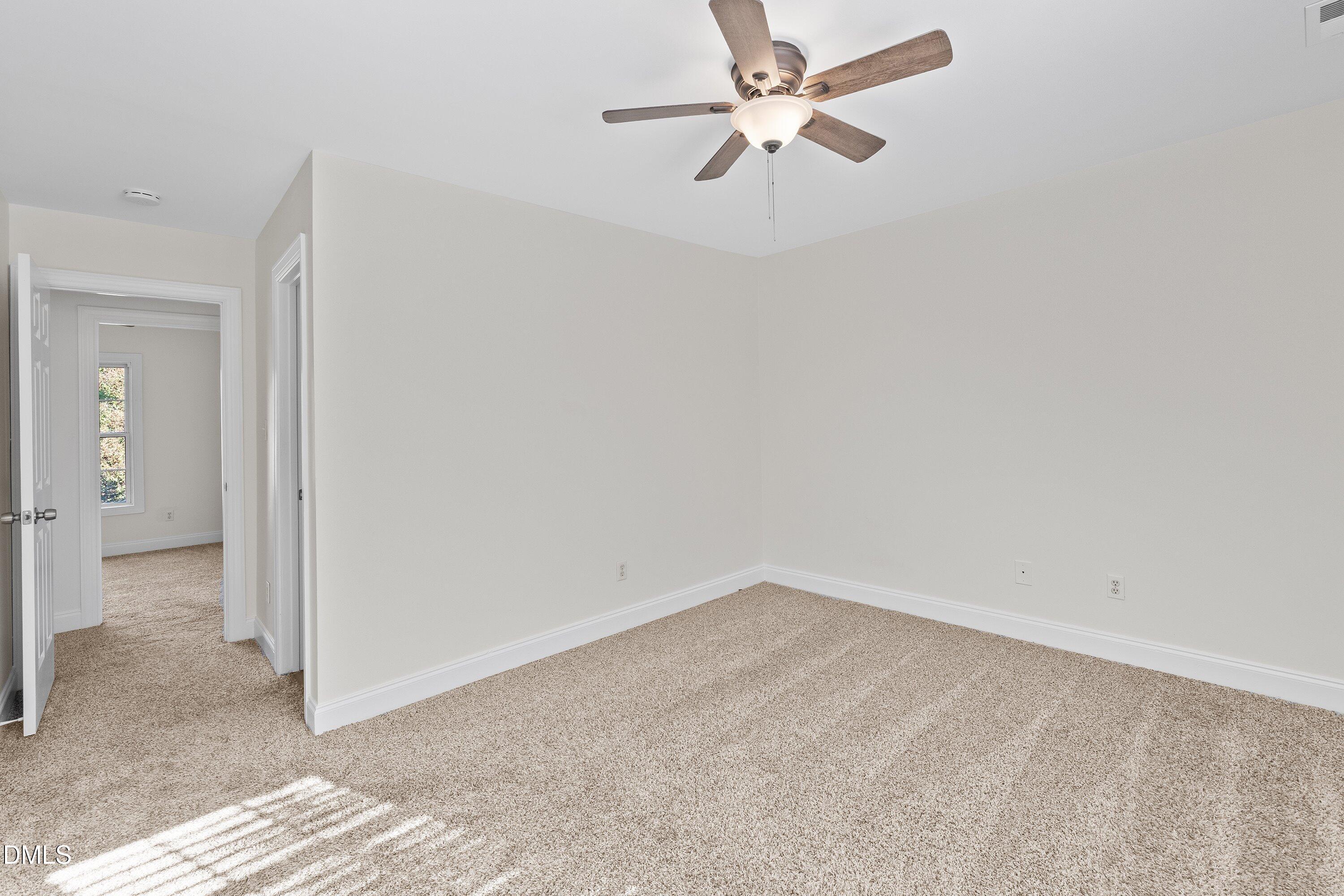 4120 Standing Rock Way Raleigh, NC 27604 - Photo 27 of 37 an empty room with a fan and a fan