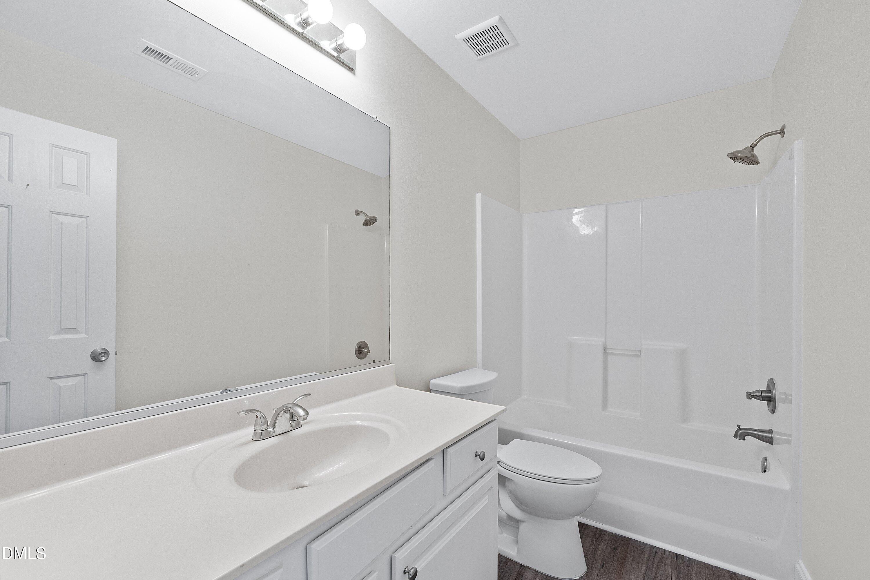 4120 Standing Rock Way Raleigh, NC 27604 - Photo 29 of 37 a bathroom with a sink a toilet and shower