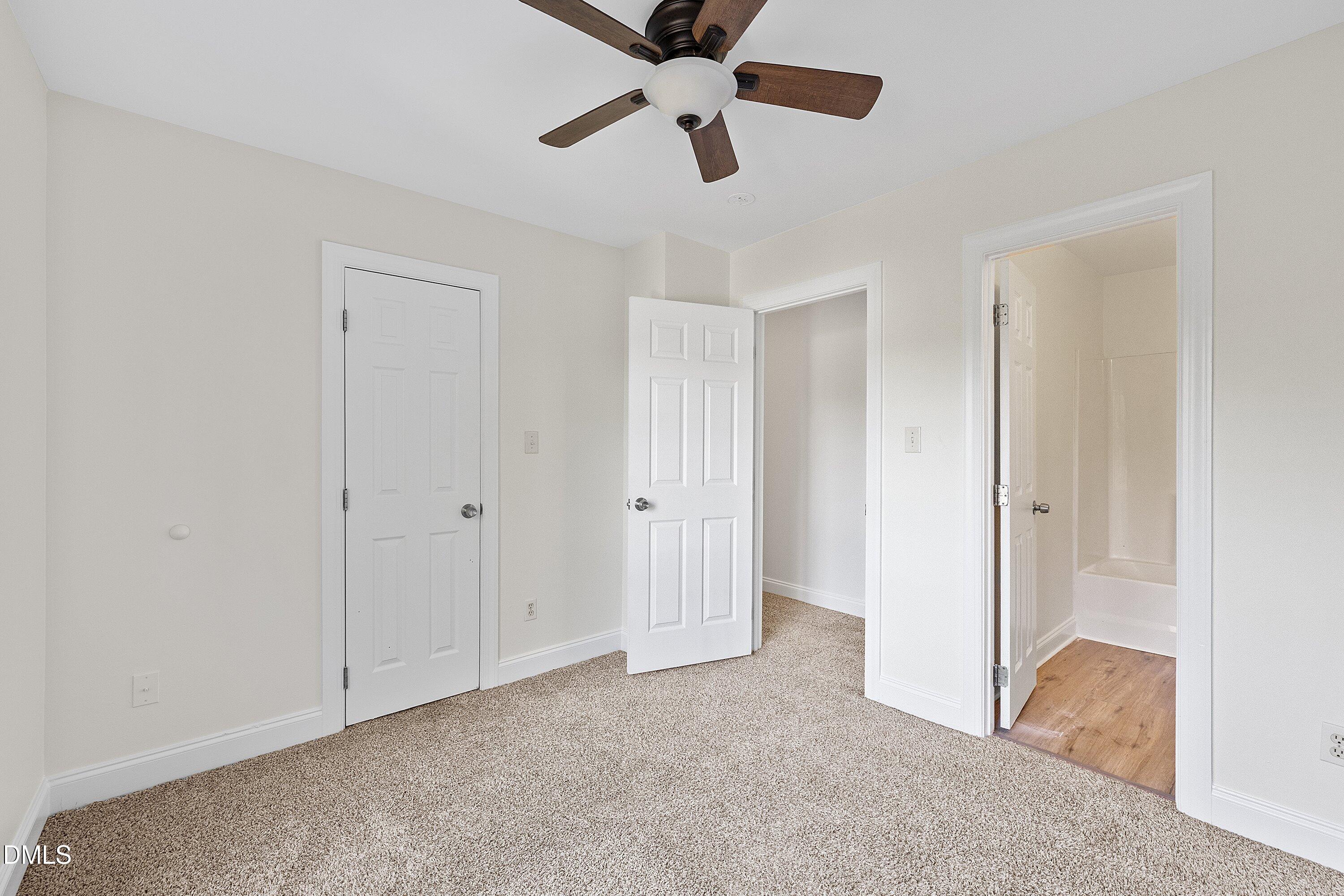 4120 Standing Rock Way Raleigh, NC 27604 - Photo 31 of 37 a view of an empty room and chandelier fan