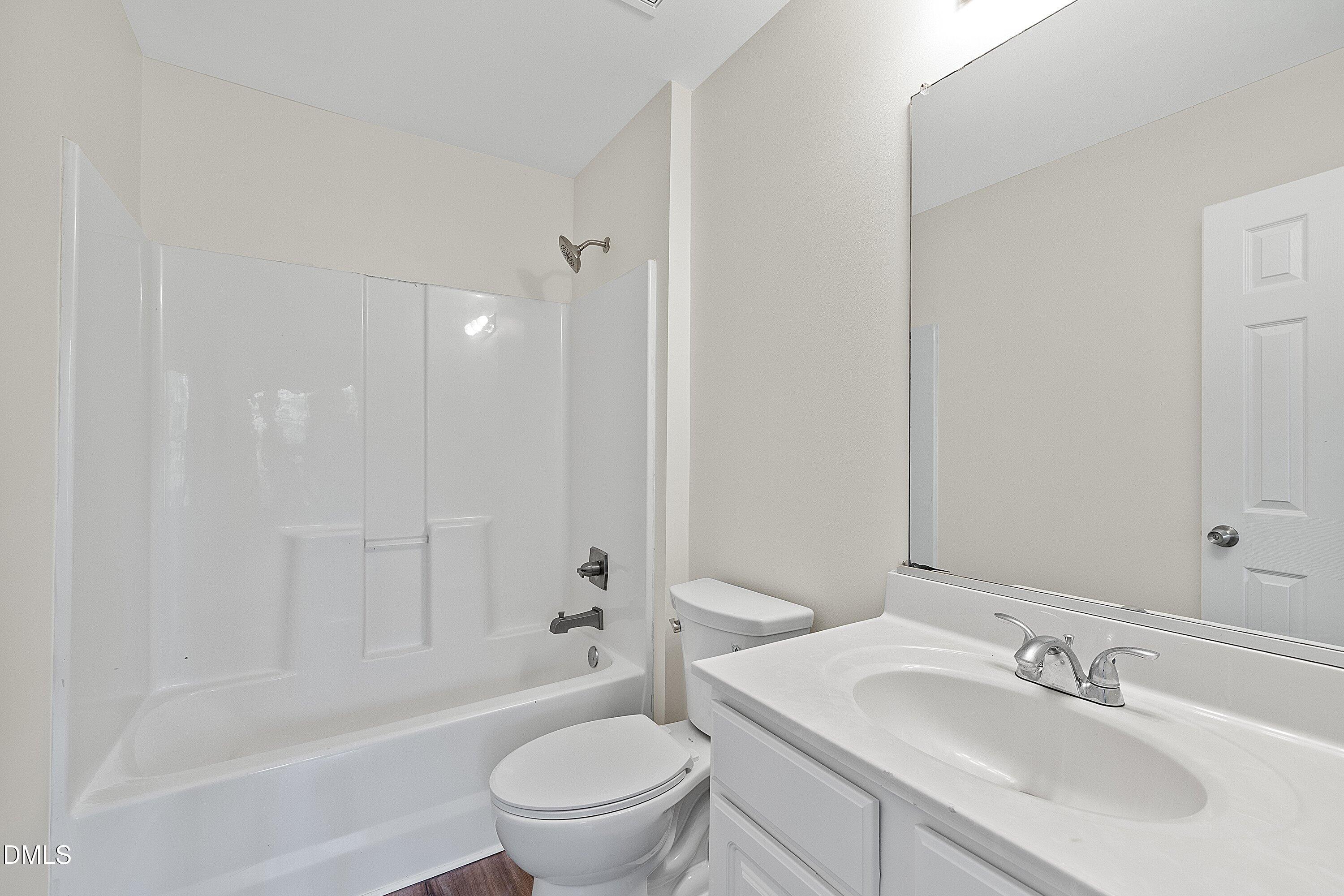 4120 Standing Rock Way Raleigh, NC 27604 - Photo 32 of 37 a bathroom with a sink toilet and shower