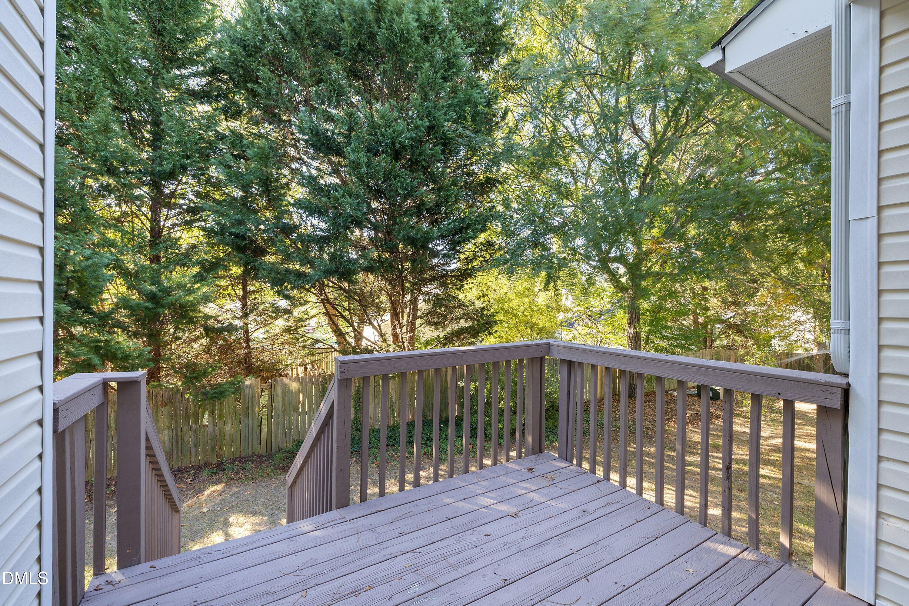 4120 Standing Rock Way Raleigh, NC 27604 - Photo 34 of 37 a balcony with wooden floor and yard in the back