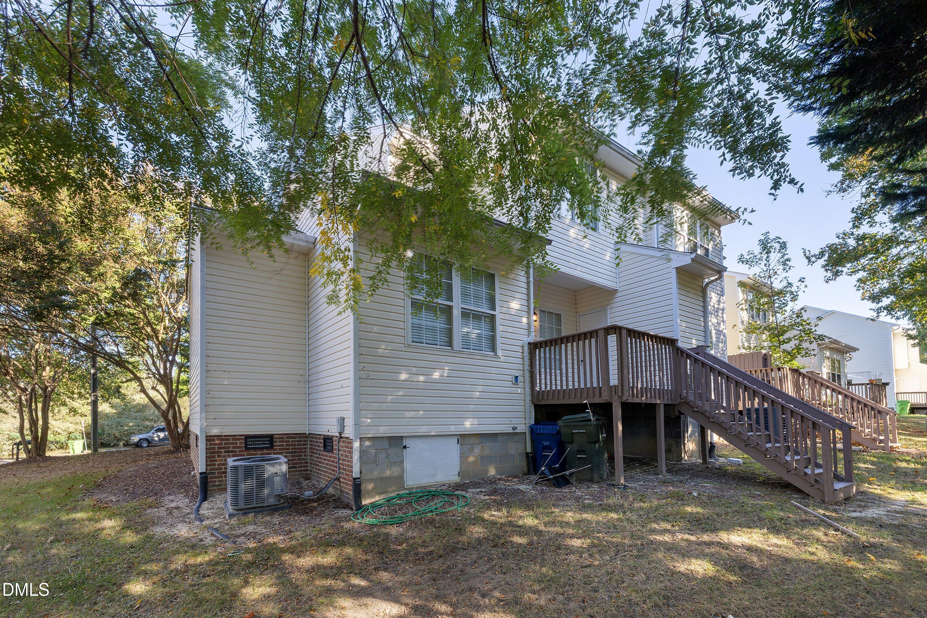 4120 Standing Rock Way Raleigh, NC 27604 - Photo 36 of 37 a view of a house with a large tree and wooden fence