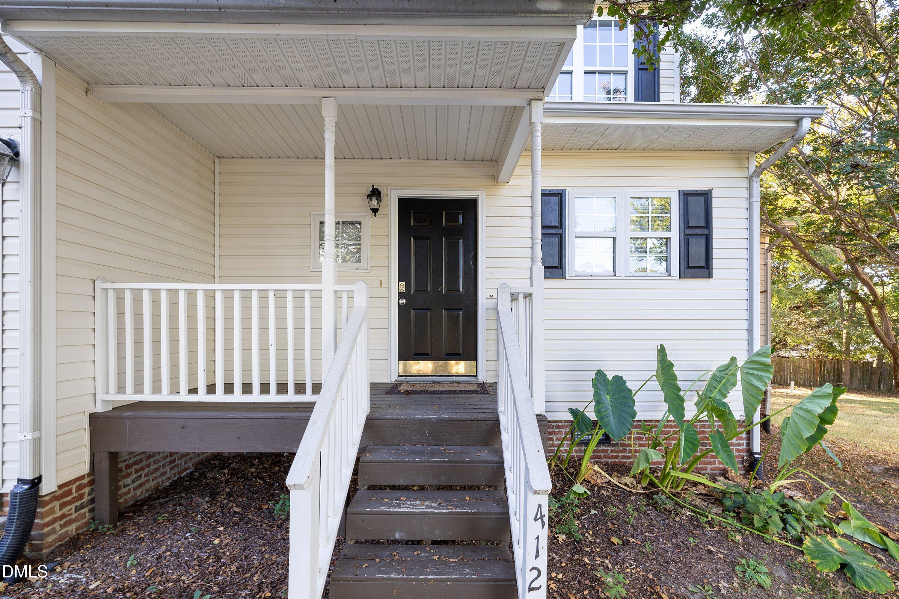 4120 Standing Rock Way Raleigh, NC 27604 - Photo 4 of 37 a view of a house with backyard and sitting area