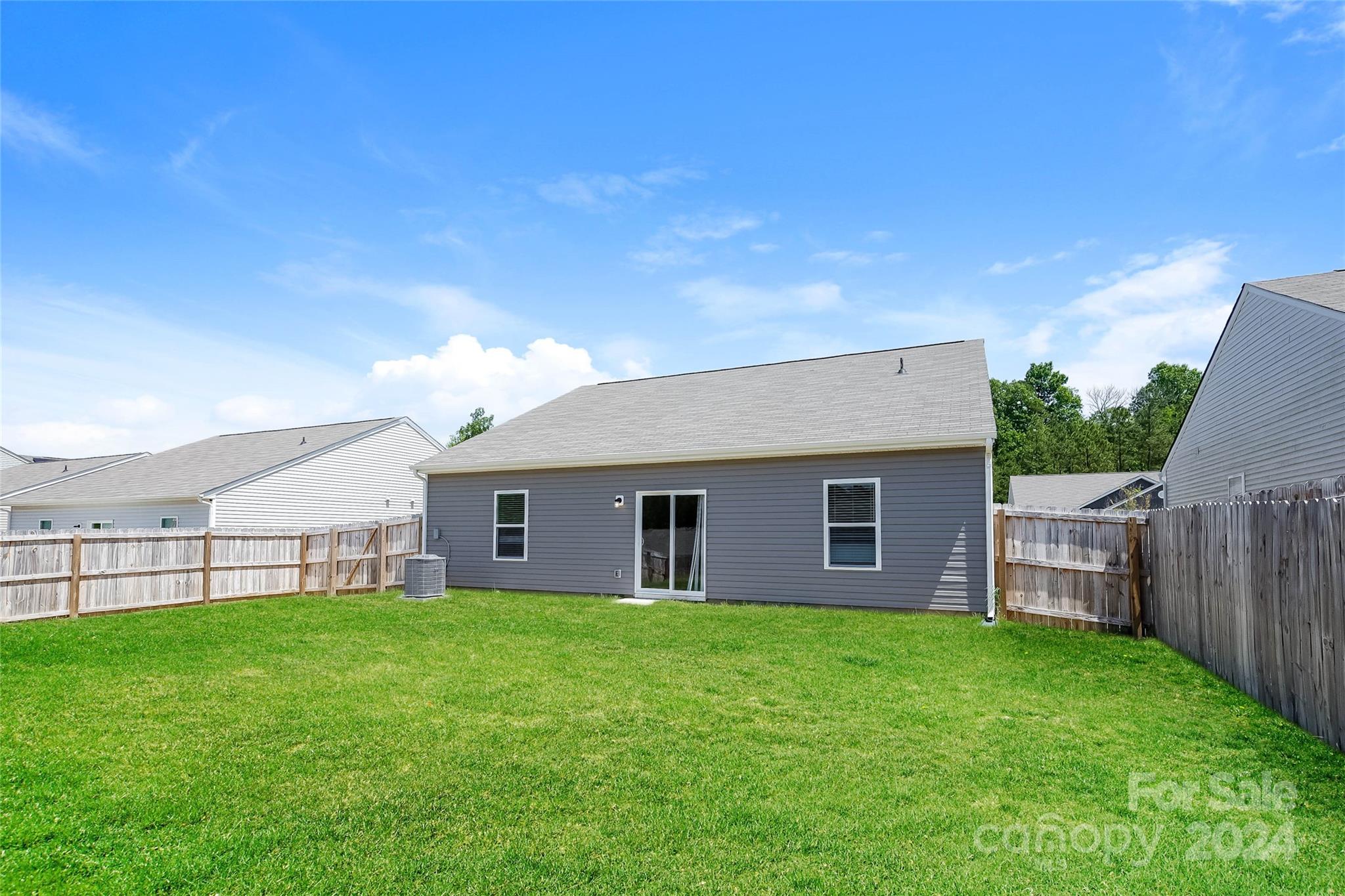 7323 Amberly Hills Road Charlotte, NC 28215 - Photo 14 of 14 a view of a house with a yard and sitting area