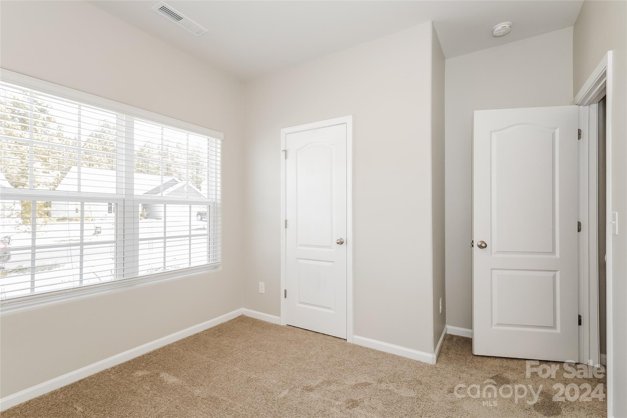 7323 Amberly Hills Road Charlotte, NC 28215 - Photo 5 of 14 a view of an empty room with a window