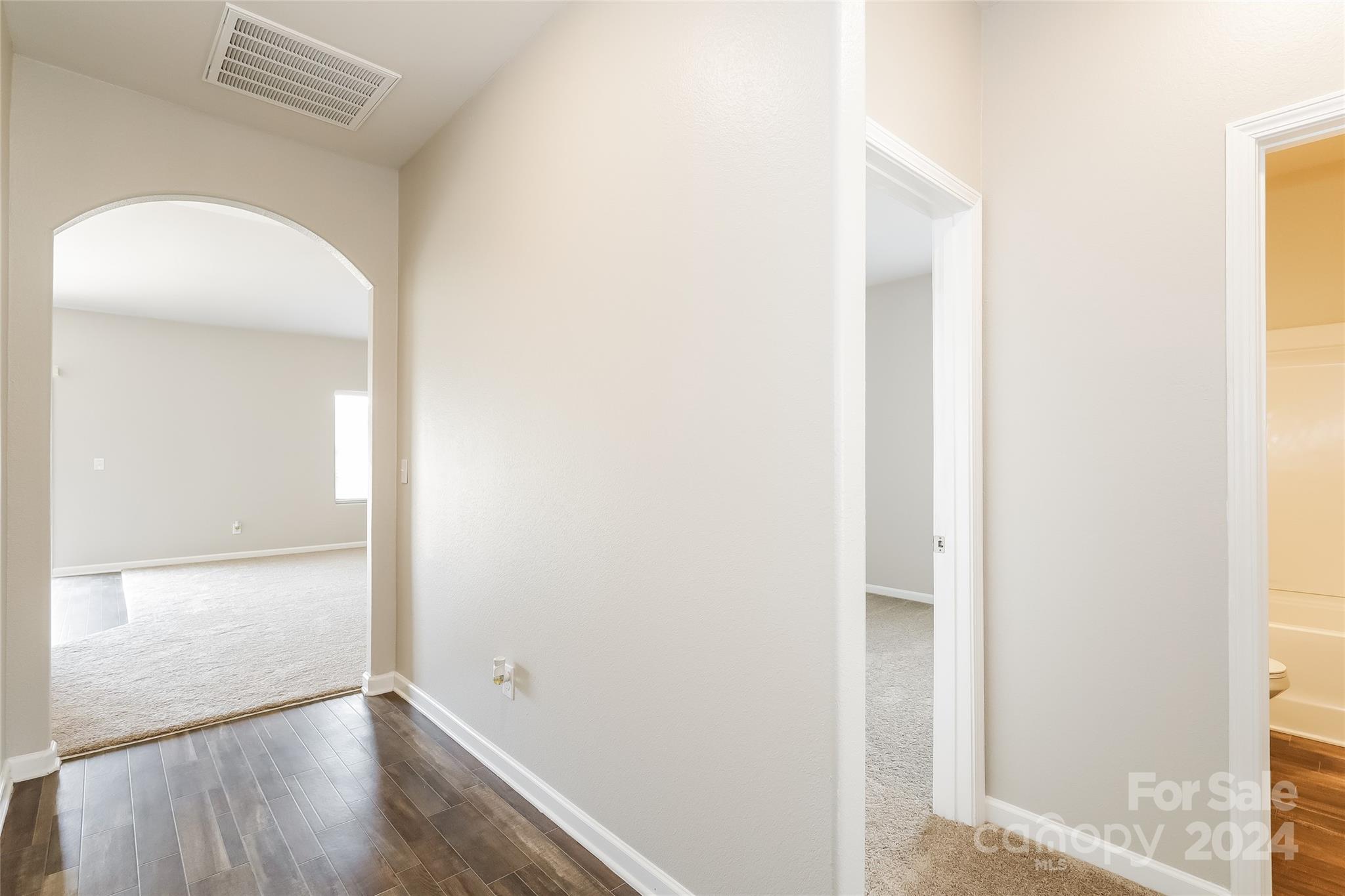 7323 Amberly Hills Road Charlotte, NC 28215 - Photo 7 of 14 a view of a hallway with wooden floor