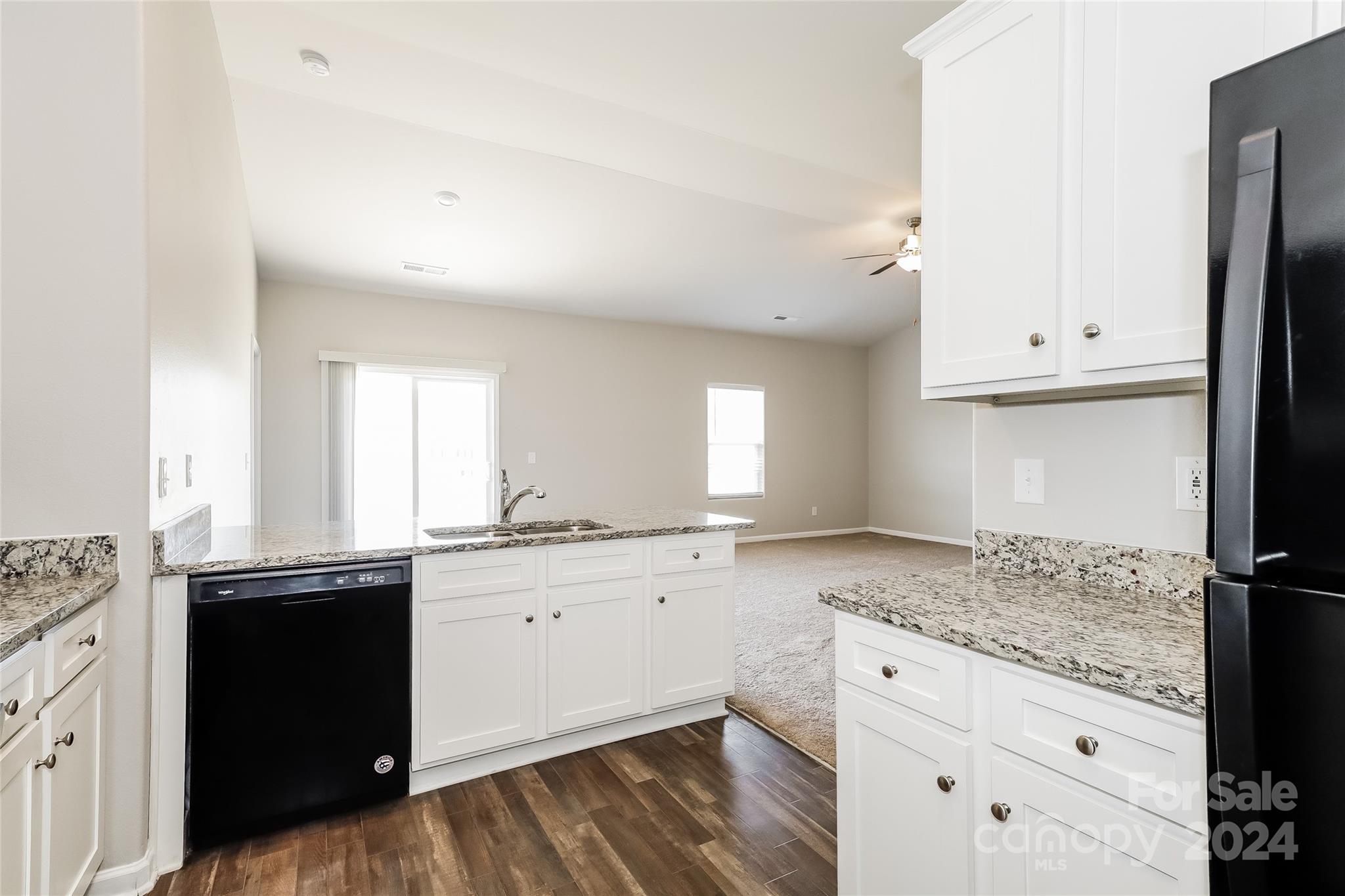 7323 Amberly Hills Road Charlotte, NC 28215 - Photo 8 of 14 a kitchen with granite countertop a sink and cabinets
