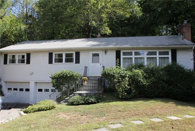 93 Old Colony Road Stamford, CT 06907 - Photo 1 of 1 a front view of a house with a yard