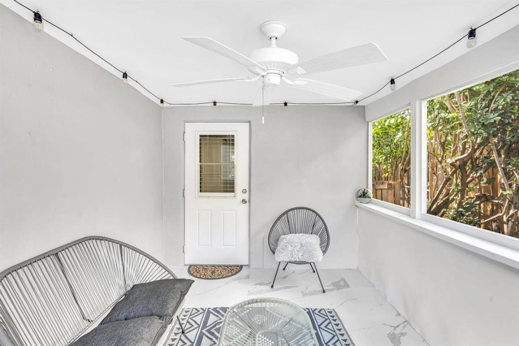 253 Southwest 7th Street, Unit A Dania Beach, FL 33004 - Photo 7 of 22 a bedroom with a bed and a window