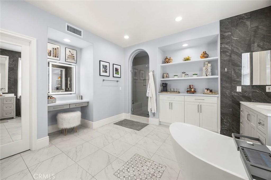 16 Kempton Lane Ladera Ranch, CA 92694 - Photo 39 of 60 Luxury primary bathroom with custom vanity lighting.